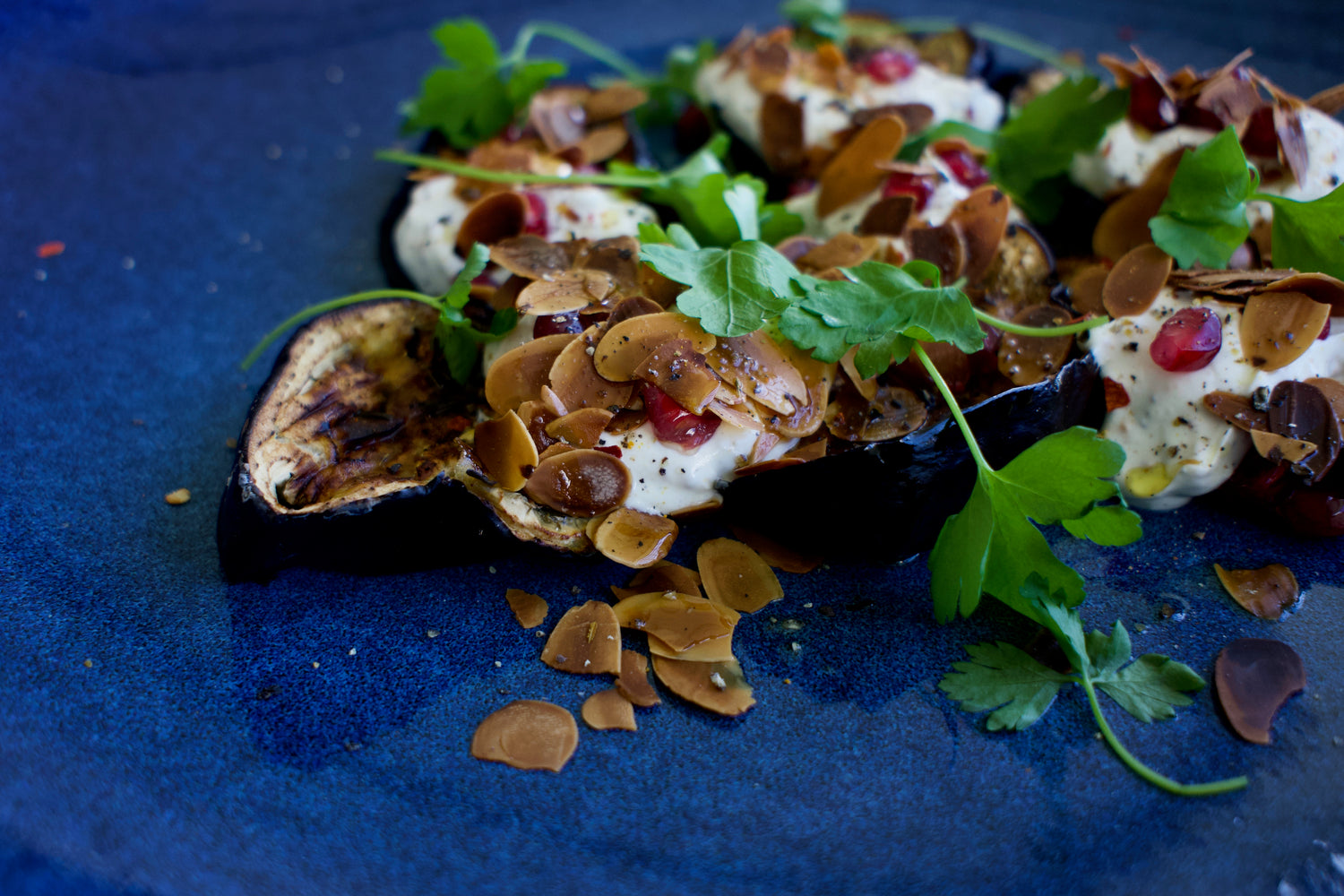 ROASTED AUBERGINES WITH ALMONDS AND POMEGRANATE SEEDS