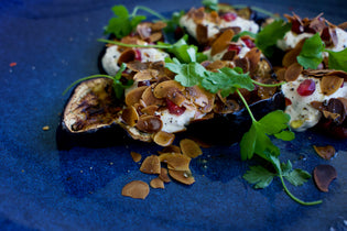  ROASTED AUBERGINES WITH ALMONDS AND POMEGRANATE SEEDS